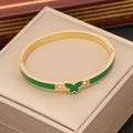 Bracciale in acciaio dorato con farfalla in smalto verde e strass brillanti - Verde