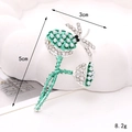 Macro detail of 5cm silver alloy sunflower brooch with green rhinestones and pearls - Dragonfly Lotus Pod / Silver