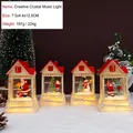 Set di 4 carillon natalizi a LED con scene di Babbo Natale e pupazzo di neve - Luce Musicale Casa di Natale Squisita (2457)