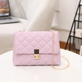 Chic lavender quilted crossbody bag with gold chain strap on marble surface - Purple