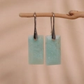 Minimalist light blue rectangular drop earrings on natural wood stand display - Green Aventurine Silver Hook