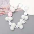 Beaded phone wrist strap with white plush balls and pink relief charm detail - White Cameo Style (K2766)
