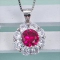 Silver halo necklace featuring a vibrant red round gemstone surrounded by white crystals - Necklace