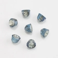 Macro shot of 8mm blue faceted cone-shaped crystal beads on white background - Dark Blue Plated