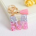 Pink glitter resin letter M keychain with gold ring and matching pink tassel pendant - Letter M / Pink