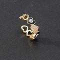 Detail of gold evil eye heart ring featuring black enamel and micro-pave cubic zirconia - Style 4-Black Heart Eye