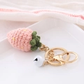 Handmade strawberry crochet keychain in pink yarn with small bell and golden hardware - Fruit Style-Strawberry