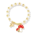 Elegante pulsera de perlas blancas con cuentas doradas y dijes de setas rojas - Seta Dorada