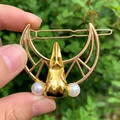 Detail of vintage gold raven skull hair clip with crescent moon and white pearls - Gold Hollow Clip + Gold Raven Head + Pearl