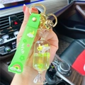 Unicorn candy shaped liquid keychain with yellow flowing sand and neon green wrist strap - Green-Fruit Candy Unicorn