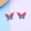 Detail of pink and blue glitter butterfly charms with gold metal frame for DIY jewelry - Rose Blue