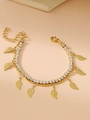 Macro view of gold double-layer bracelet with sparkling zircons and leaf charms - Leaf / 3mm / Gold