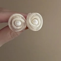 Close-up of pearl flower earrings with spiral petals held for detailed texture display - 4# Pearlescent White Spiral Floral Studs (HE15735)