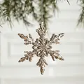 Champagne gold glitter snowflake ornament hanging on a pine branch for Christmas decor - Champagne Snowflake