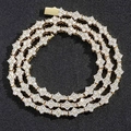 Makroansicht von Hip-Hop-Schmuck mit blauen und klaren Zirkoniasteinen in Pavé-Fassung - 7-Zoll-Armband (Länge ca. 18cm) / Gold
