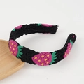 Detail of crochet headband featuring strawberry patterns on a black knitted base - Black Strawberry