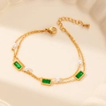 Double-layered gold bracelet with emerald green crystals and elegant white faux pearls - Pearl Square
