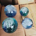 Set of ocean glass crystal spheres with blue spiral waves and interior bubble texture - 100mm Ocean Wave Ball - Lake Blue