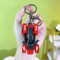 Mini red racing ATV quad bike keychain toy model accessory held in hand for scale - Beach Motorbike Keychain - Red
