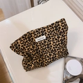 Detail view of the retro leopard print canvas makeup bag with secure zipper closure - Brown and Yellow Leopard Print