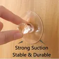 Transparent suction hook with crystal-cut handle design on a wooden furniture surface - Round Crystal Handle