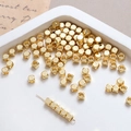 Macro shot of 14k gold-plated cube spacer beads with a smooth metallic finish for DIY jewelry - 4mm 18k Gold (10 Pcs)