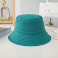 Teal cotton bucket hat displayed on white table with aesthetic lifestyle props - M / Wide Brim / Teal