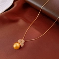 Detailed macro view of an 18k gold-plated flower pendant featuring a large golden pearl - Necklace (10#) / Gold