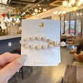 Elegant gold pearl rhinestone hair clip shown in a warm cafe setting for women - 78# H Style Oval Frog Pearl Clip / Gold/White