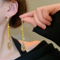 Close-up of model wearing gold drop earrings with yellow beads and pearl tassels - Silver Earring Post Rhinestone Crystal Pearl Water Drop Tassel Oval Studs