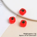 Detailed macro view of mini resin tomato charms with dimensions 14x16x13mm and 2.2g weight - Tomato