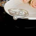 Close-up of a multi-layer silver pearl bracelet with pave-set zircon on white ceramic - Three Layer Large Pearl Accent Open Style (8# Bangle-Silver) / Silver