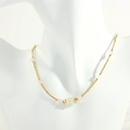 Detail of beaded gold chain necklace with white translucent stones on a white mannequin - White Crystal (NE1991)