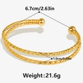 Detailed view of dual-layer gold 304 stainless steel bangle with dimensions 6.7cm and 2.1g weight - Gold