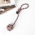 Detailed view of red, green and white woven cotton dog rope ball with a durable handle - Christmas Woven Tug Ball 35cm (100g)