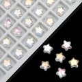 Macro detail of 8mm iridescent star glass beads for DIY jewelry making in a plastic tray - AB White