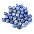 Spherical blue and white sodalite stone beads for DIY jewelry making on white background - Blue Spot Jasper