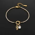 Gold-plated stainless steel rhinestone tennis bracelet with gothic letter 'g' charm - Letter G