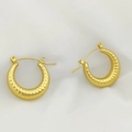 Macro shot of gold croissant hoop earrings with ribbed texture on white fabric - Ribbed Croissant Style (XL1464-67)