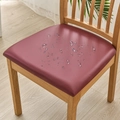 Waterproof red PU leather chair seat cover with water droplets on a wooden chair - Burgundy