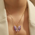 Titanium steel gold necklace with a purple butterfly pendant and heart zircon on a model - Purple Butterfly (DJN029GL-LA)