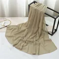 Elegant khaki pearl chiffon hijab scarf with delicate rolled edges on a display stand - 175cmx70cm / Pale Green