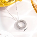 Detail showing 23mm silver round pendant with sparkling crystals and screw head motifs - Full Star Silver