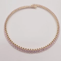 Elegant gold necklace with purple oval-cut zircons arranged in a classic circle - Pink