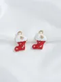 Detailed macro view of Christmas stocking charms with red enamel and gold snowflake pattern - Red Christmas Sock (17)