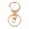 Close-up of a polished gold lobster clasp with a swivel snap and flat keyring loop - D-ring Lobster Clasp + 8-Connector / Gold