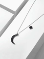 Elegante zilverkleurige ster en maan ketting met zwarte pavé gezette kristallen - Titanium Staal Witgoud