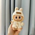 Labubu plush toy wearing white bunny ear knit sweater and hat, handheld display view - White Wooden Button Sweater + White Bear-patterned Hat / First And Second Generation Keychains Are Compatible With La Cloth Dolls. Dolls Not Included.