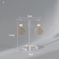 White pearl earrings with golden hollow circle pendants on a 11cm acrylic display stand - Transparent Small Hexagon Base