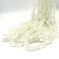 Macro shot of natural irregular transparent crystal chips strand for DIY jewelry making - Clear Quartz approx 80cm
